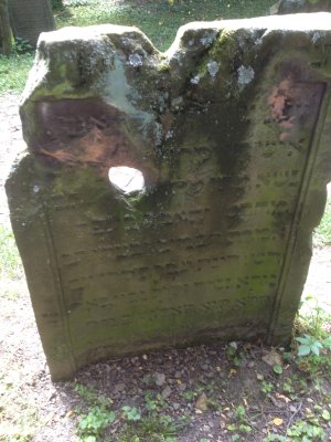 Grave Marker With Bullet Hole